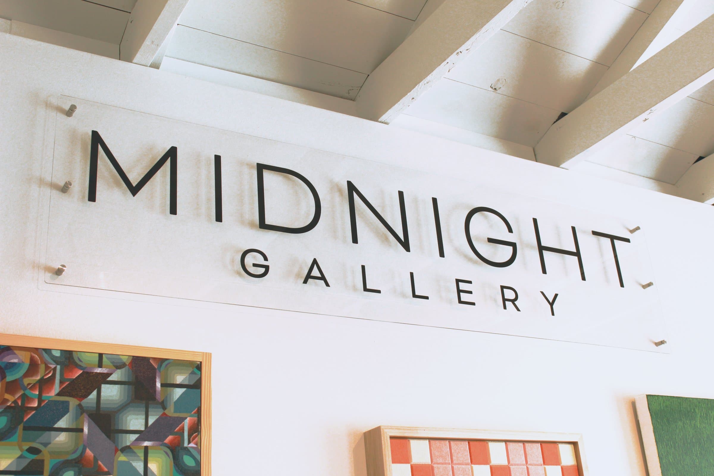 The Midnight Gallery sign above the entrance